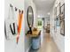 Bright hallway with tiled floors, staircase, and views into the dining room, blending style and functionality at 3637 Copper Beech Dr, Land O Lakes, FL 34638