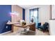 A modern home office with a sleek desk, comfortable seating, and decor, creating a productive workspace at 3637 Copper Beech Dr, Land O Lakes, FL 34638