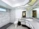 Renovated bathroom showcasing white marble tiles, a modern shower, and sleek vanity at 3900 38Th S St, St Petersburg, FL 33711