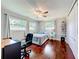 Bright bedroom with windows, ceiling fan, closet, and desk at 3900 38Th S St, St Petersburg, FL 33711