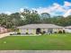 Charming single-story home features a well-manicured lawn and elegant exterior details at 3900 38Th S St, St Petersburg, FL 33711