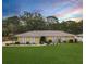 Charming single-story home boasts a well-manicured lawn and decorative exterior lighting at 3900 38Th S St, St Petersburg, FL 33711
