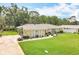 Inviting single-story home boasting a beautifully maintained lawn and mature landscaping for added appeal at 3900 38Th S St, St Petersburg, FL 33711