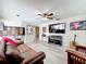 Cozy living room features hardwood floors, comfortable seating, and a view into the kitchen at 3900 38Th S St, St Petersburg, FL 33711