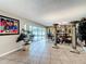 Open living space leads to dining room with sliding doors to patio and pool at 3900 38Th S St, St Petersburg, FL 33711