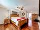 Comfortable main bedroom with hardwood floors and large wooden bed frame at 3900 38Th S St, St Petersburg, FL 33711