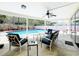 Covered patio featuring comfortable seating and a view of the sparkling pool at 3900 38Th S St, St Petersburg, FL 33711