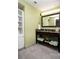 Bathroom featuring a vanity with granite countertop, cabinet, and neatly arranged towels at 399 2Nd St # 417, Indian Rocks Beach, FL 33785