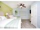 Spacious bedroom featuring two beds, a ceiling fan, and light blue walls at 399 2Nd St # 417, Indian Rocks Beach, FL 33785