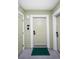 Apartment entrance with light green walls, unit number, and a welcome mat at 399 2Nd St # 417, Indian Rocks Beach, FL 33785