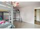 Bright bedroom featuring a bunk bed, closet and light-colored walls at 4406 W Harbor View Ave, Tampa, FL 33611