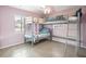 Shared bedroom with bunk beds, ample natural light, and neutral color palette at 4406 W Harbor View Ave, Tampa, FL 33611