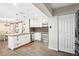 Bright kitchen with stainless steel appliances, granite counters, and sliding barn door to dining area at 4406 W Harbor View Ave, Tampa, FL 33611