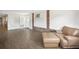 Spacious living room showcases wood-look floors and brick accents throughout the home at 4406 W Harbor View Ave, Tampa, FL 33611