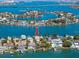Aerial view of waterfront community showcasing the home's location and boat docks at 474 20Th Ave, Indian Rocks Beach, FL 33785