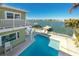 A beautiful backyard, outdoor seating, pool and a private boat dock at 474 20Th Ave, Indian Rocks Beach, FL 33785