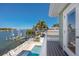 Balcony view of the pool, private dock, and waterfront at 474 20Th Ave, Indian Rocks Beach, FL 33785