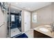 Bathroom featuring a shower and double sink vanity at 474 20Th Ave, Indian Rocks Beach, FL 33785