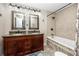 Bathroom with double vanity, bathtub and shower at 474 20Th Ave, Indian Rocks Beach, FL 33785