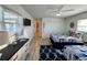 Stylish nautical themed bedroom with wood-look floors, two beds, and a view of the water at 474 20Th Ave, Indian Rocks Beach, FL 33785