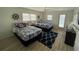 Stylish nautical-themed bedroom with two beds, a ceiling fan, and a view of the water at 474 20Th Ave, Indian Rocks Beach, FL 33785
