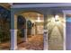 Home's portico entrance has detailed brickwork and a well-lit walkway at 474 20Th Ave, Indian Rocks Beach, FL 33785