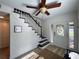 Inviting foyer with a decorative front door, staircase, and modern flooring at 474 20Th Ave, Indian Rocks Beach, FL 33785