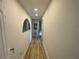 Hallway with wood floor and beach themed decorations at 474 20Th Ave, Indian Rocks Beach, FL 33785