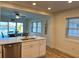 Kitchen featuring a breakfast bar, stainless steel appliances, and a view of the waterfront dining area at 474 20Th Ave, Indian Rocks Beach, FL 33785