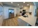 Bright kitchen with stainless steel appliances, white cabinetry, and modern countertops at 474 20Th Ave, Indian Rocks Beach, FL 33785