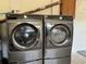 Laundry room featuring a modern, front-loading washer and dryer at 474 20Th Ave, Indian Rocks Beach, FL 33785