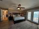 Comfortable main bedroom featuring a ceiling fan, water view, and a doorway to an en-suite bathroom at 474 20Th Ave, Indian Rocks Beach, FL 33785