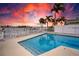 Beautiful waterfront pool with a stunning sunset view, perfect for relaxing and entertaining at 474 20Th Ave, Indian Rocks Beach, FL 33785