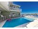 Inviting pool area with waterfront views, patio furniture, and canal access at 474 20Th Ave, Indian Rocks Beach, FL 33785