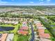 Aerial view showcases beautiful community, lakes, and lush greenery at 5009 Sandy Brook Cir, Wimauma, FL 33598