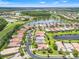 Aerial view showcases beautiful community, lakes, and lush greenery at 5009 Sandy Brook Cir, Wimauma, FL 33598