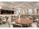 Elegant ballroom featuring a stage, tables, chairs, and tasteful decor perfect for events and gatherings at 5009 Sandy Brook Cir, Wimauma, FL 33598
