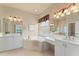 Bathroom featuring tub, and sinks, granite counters, vanity, and walk-in shower at 5009 Sandy Brook Cir, Wimauma, FL 33598