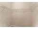 Walk-in closet with built-in shelving for organizing clothes, shoes, and accessories at 5009 Sandy Brook Cir, Wimauma, FL 33598