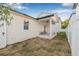 Charming back porch with brick flooring, ceiling fan, and fenced yard at 5120 3Rd N Ave, St Petersburg, FL 33710