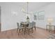 Bright dining room featuring paneled walls, modern lighting, and light wood flooring at 5120 3Rd N Ave, St Petersburg, FL 33710