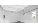 Bright, clean garage interior with an automatic door, a window, and access door at 5120 3Rd N Ave, St Petersburg, FL 33710
