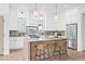 Modern kitchen featuring a center island with seating, marble countertops, and stainless steel appliances at 5120 3Rd N Ave, St Petersburg, FL 33710
