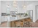 Modern kitchen featuring a center island with seating, marble countertops, and stainless steel appliances at 5120 3Rd N Ave, St Petersburg, FL 33710
