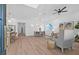 Bright, open-concept living room with hardwood floors, dining area, comfortable seating, and modern decor at 5120 3Rd N Ave, St Petersburg, FL 33710