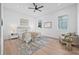 Bright main bedroom featuring a ceiling fan, stylish furniture, and windows at 5120 3Rd N Ave, St Petersburg, FL 33710
