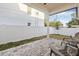 A covered outdoor patio features brick flooring and comfortable seating at 5120 3Rd N Ave, St Petersburg, FL 33710