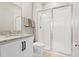 Bathroom with granite counters, modern fixtures, large mirror and glass-enclosed shower at 520 Valri Park Dr, Valrico, FL 33594