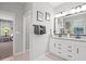 Bright bathroom featuring a double vanity with granite countertop and modern fixtures at 520 Valri Park Dr, Valrico, FL 33594