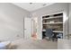 Comfortable bedroom space, featuring an open office space for a home office at 520 Valri Park Dr, Valrico, FL 33594